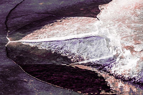 Abstract Ice Sculpture Forms Atop Frozen River (Pink Tint Photo)