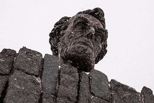 Blowing Snow Across Presidential Statue Head (Pink Tint Photo)