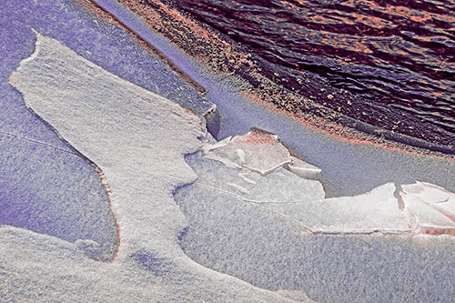 Broken Cracked Ice Along Shoreline (Pink Tint)