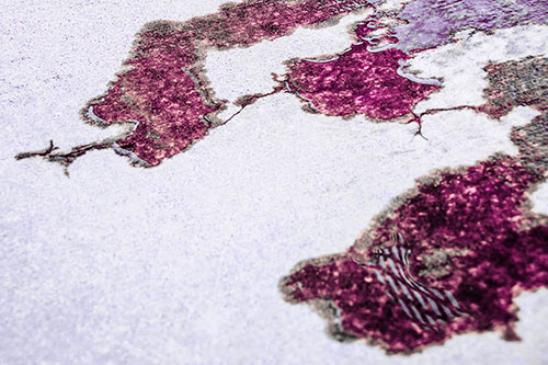 Creeping Water Puddle Across Concrete Pavement (Pink Tint)