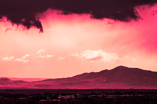 Dark Cloud Mass Above Mountain Range Horizon (Pink Tint Photo)