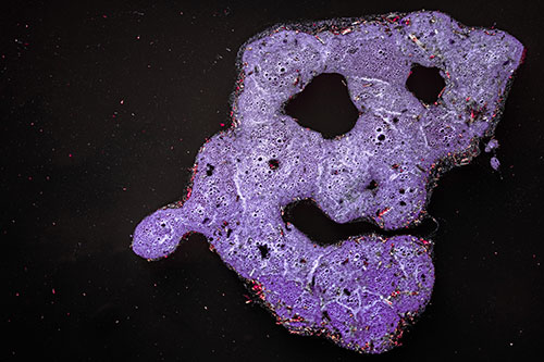 Droopy Smiling Bubble Face Floating Above Soil (Pink Tint)