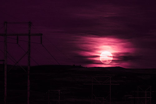 Full Moonrise Behind Mountain (Pink Tint Photo)