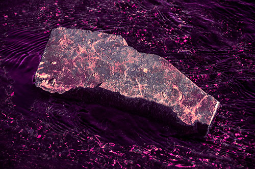 Massive Rock Atop Riverbed (Pink Tint Photo)