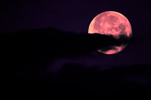 Pac Man Moon Swallows Clouds (Pink Tint Photo)