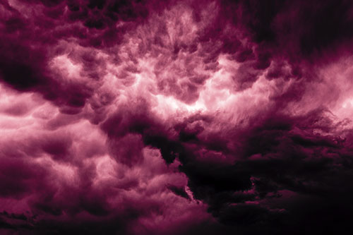 Raging Thunderstorm Clouds Brewing Among Sky (Pink Tint)