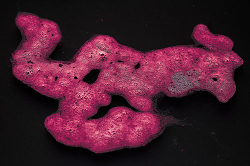 Sorrow Morphing Bubble Face Floating Above Soil (Pink Tint)