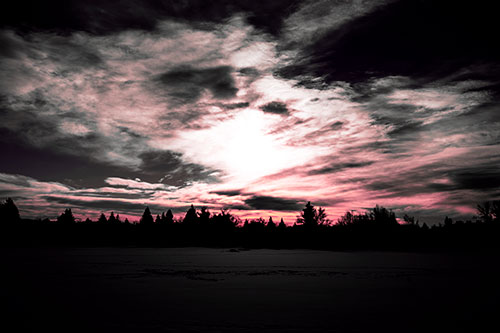 Sun Vortex Illuminates Clouds Above Dark Lit Lake (Pink Tint Photo)