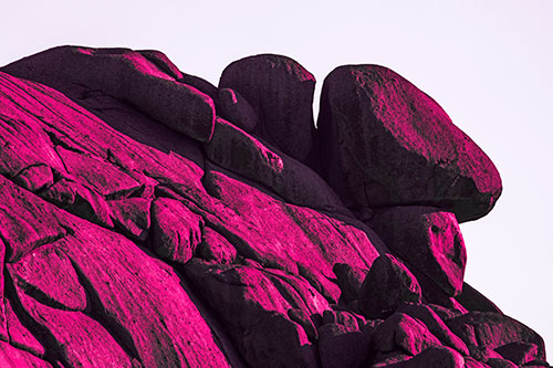 Sunlight Casting Shadows On Mountain Of Rocks (Pink Tint Photo)