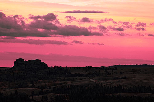 Sunrise Over Rock Formations On The Horizon (Pink Tint Photo)