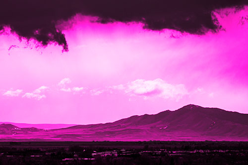 Dark Cloud Mass Above Mountain Range Horizon (Pink Tone Photo)