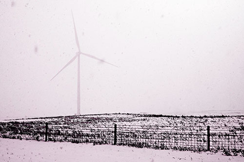 Fenced Wind Turbine Among Blowing Snow (Pink Tone Photo)