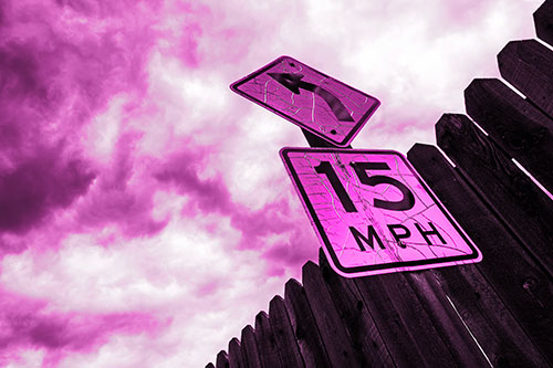Left Turn Speed Limit Sign Beside Wooden Fence (Pink Tone Photo)