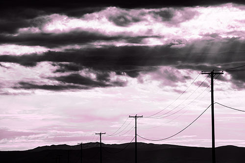 Powerline Silhouette Entering Mountain Range (Pink Tone Photo)