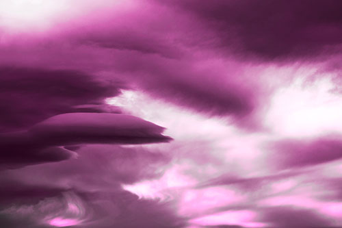 Smooth Cloud Sails Along Swirling Formations (Pink Tone Photo)