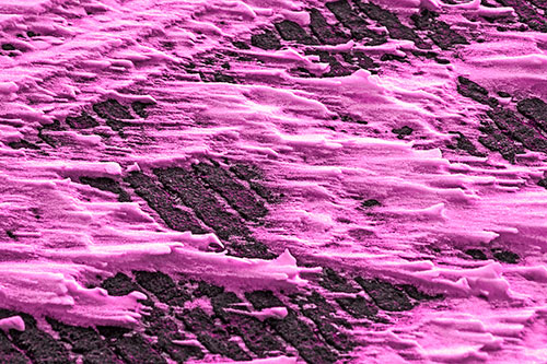 Snow Drifts Atop Rigid Pavement (Pink Tone Photo)
