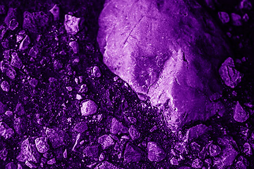 Alien Skull Rock Face Emerging Atop Dirt Surface (Purple Shade Photo)
