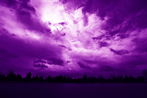 Clouds Spiraling Above Dark Lit Lake (Purple Shade Photo)