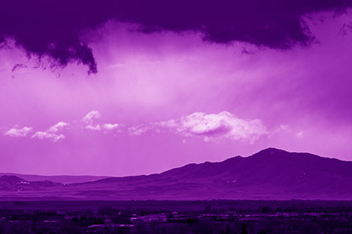 Dark Cloud Mass Above Mountain Range Horizon (Purple Shade Photo)