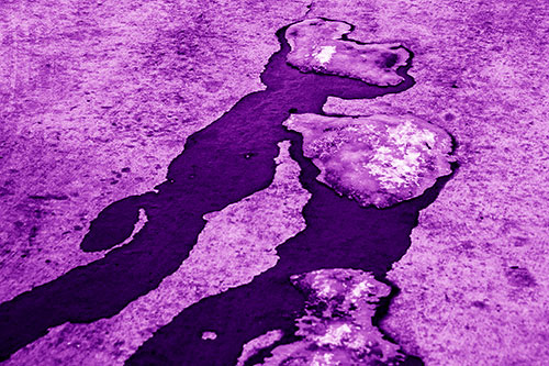 Melting Ice Puddles Forming Water Streams (Purple Shade Photo)