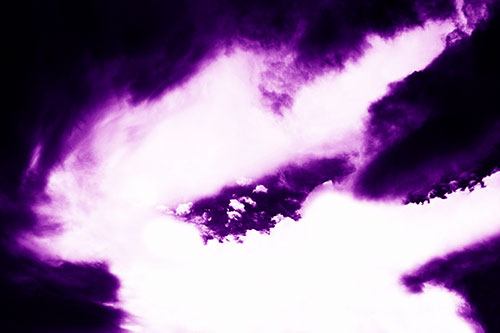 Odd Shaped Clouds Nested Within Each Other (Purple Shade Photo)
