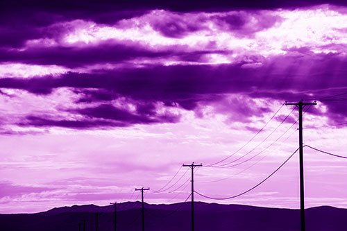 Powerline Silhouette Entering Mountain Range (Purple Shade Photo)