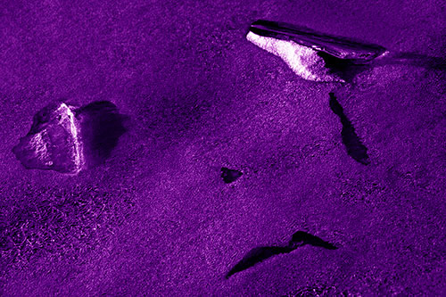Sad Teardrop Ice Face Appears Atop Frozen River (Purple Shade Photo)