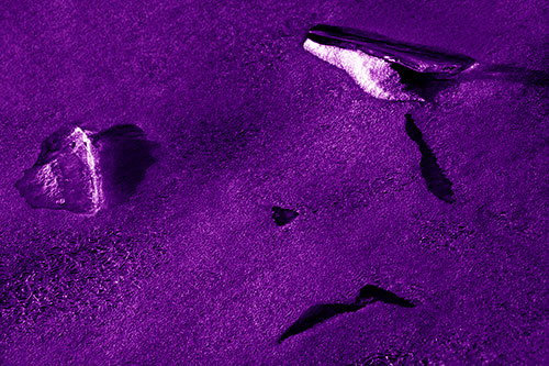 Sad Teardrop Ice Face Appears Atop Frozen River (Purple Shade)