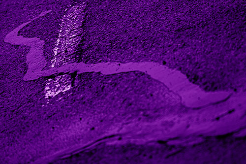 Slithering Tar Creeps Over Pavement Marking (Purple Shade Photo)