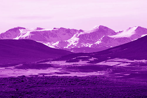 Snow Capped Mountains Behind Hills (Purple Shade Photo)