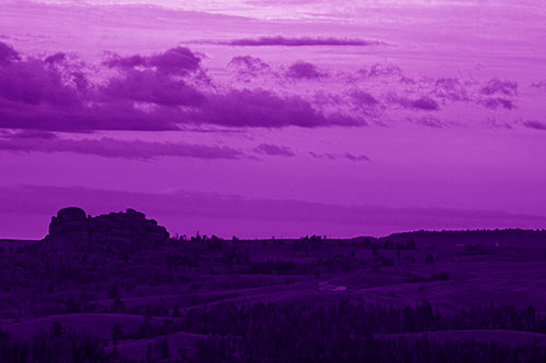 Sunrise Over Rock Formations On The Horizon (Purple Shade Photo)