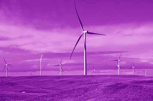 Wind Turbine Cluster Scattered Across Land (Purple Shade Photo)