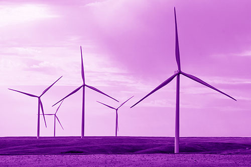Wind Turbines Standing Tall On Green Pasture (Purple Shade Photo)
