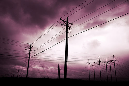 Crossing Powerlines Beneath Rainstorm (Purple Tint Photo)