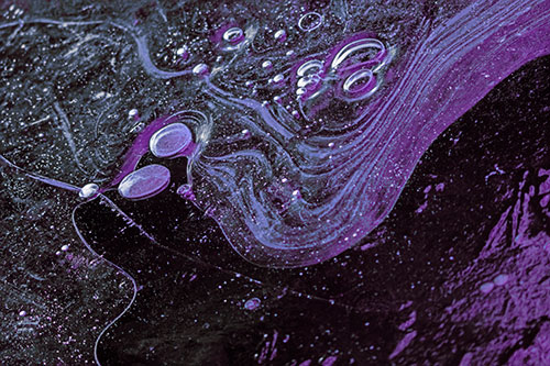 Frozen Bubble Clusters Among Twirling River Ice (Purple Tint Photo)