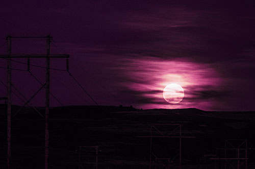 Full Moonrise Behind Mountain (Purple Tint Photo)