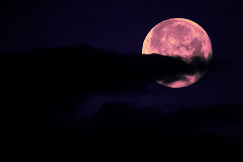 Pac Man Moon Swallows Clouds (Purple Tint Photo)