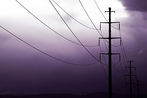 Powerlines Receding Into Thunderstorm (Purple Tint Photo)