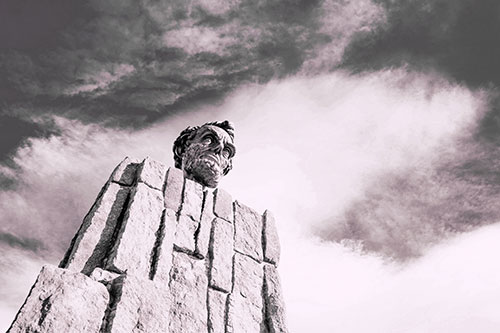 Presidents Statue Standing Tall Among Clouds (Purple Tint Photo)