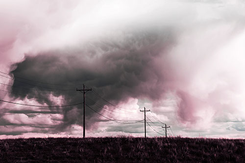 Rainstorm Clouds Twirl Beyond Powerlines (Purple Tint Photo)