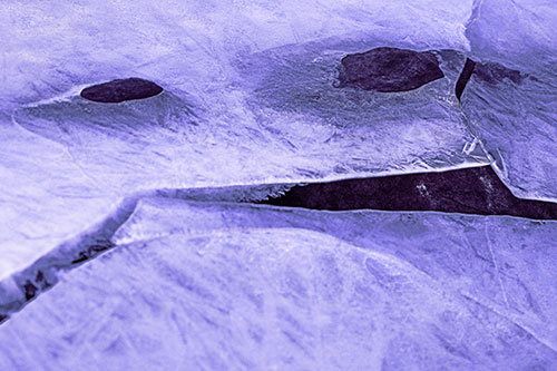 Rock Face Emerges Among Cracked Frozen Ice (Purple Tint)