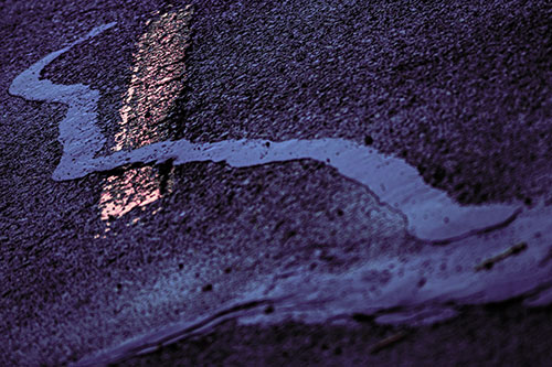 Slithering Tar Creeps Over Pavement Marking (Purple Tint Photo)