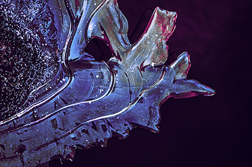 Smooth Ice Face Creature Hanging Above River Shoreline (Purple Tint)