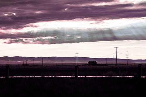 Sunlight Bursts Powerline Horizon After Rainstorm (Purple Tint Photo)