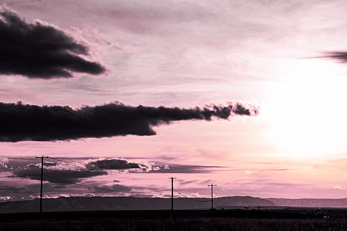 Sunsetting Beyond Powerline Mountain Range (Purple Tint Photo)