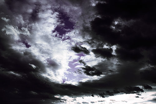 Thick Dark Cloud Refuses To Split In Half (Purple Tint Photo)