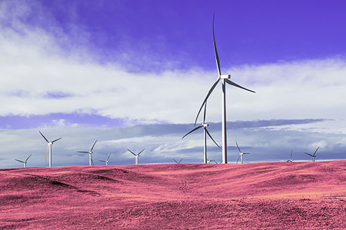 Wind Turbine Cluster Overtaking Hilly Horizon (Purple Tint Photo)