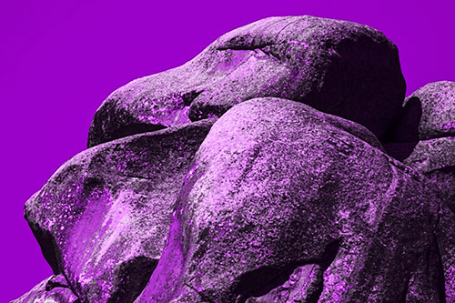 Ancient Rock Face Formation (Purple Tone Photo)