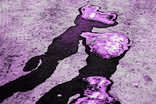 Melting Ice Puddles Forming Water Streams (Purple Tone Photo)