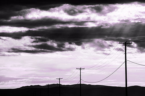 Powerline Silhouette Entering Mountain Range (Purple Tone Photo)